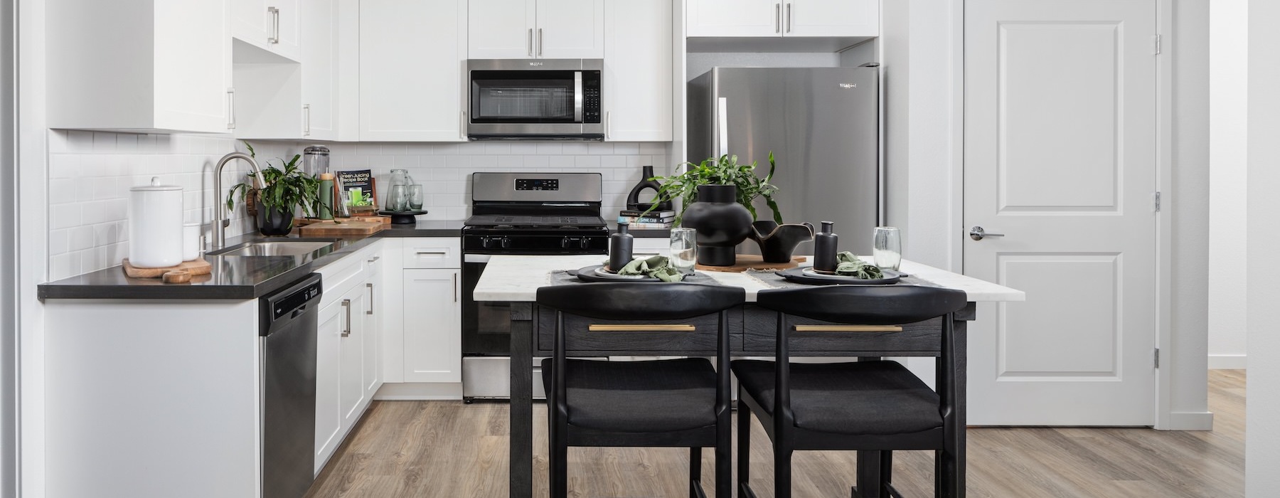 a kitchen with white cabinets