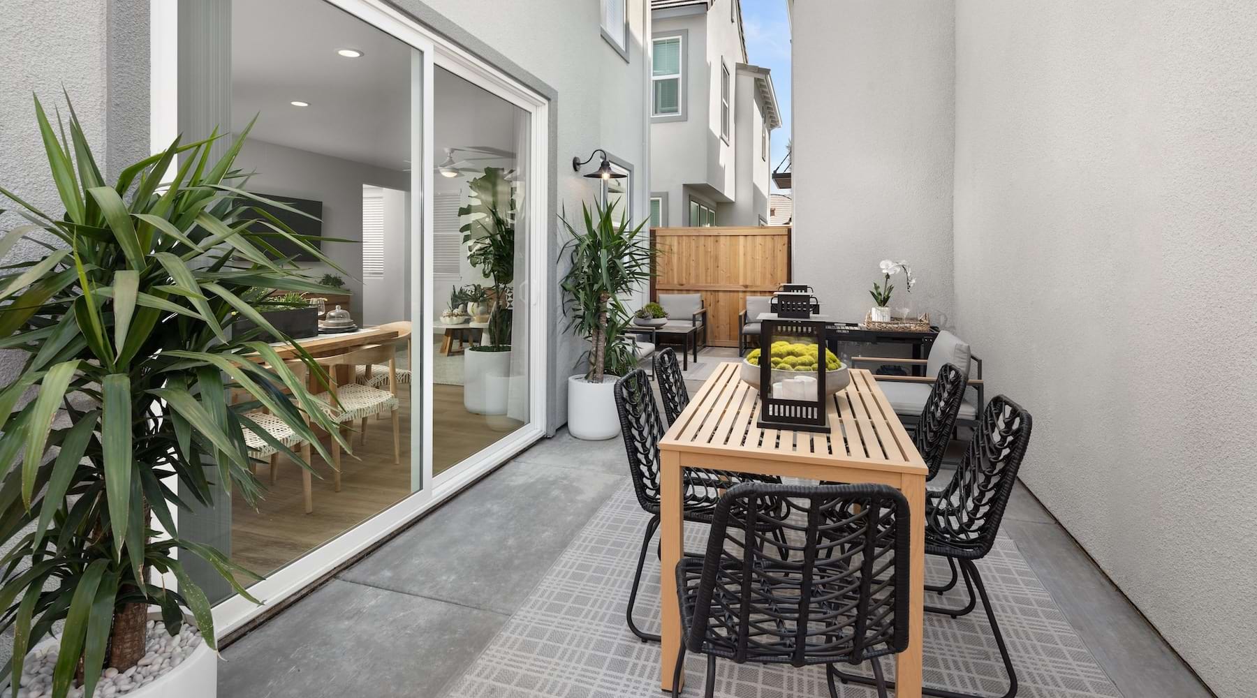 a patio with a table and chairs