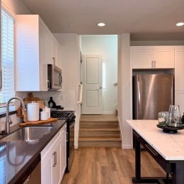 a kitchen with white cabinets